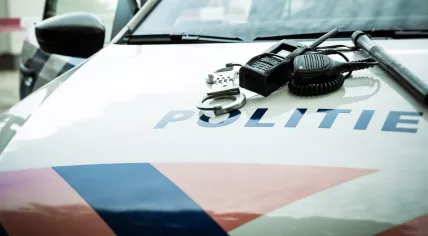 Handcuffs, radio Dutch Police Car