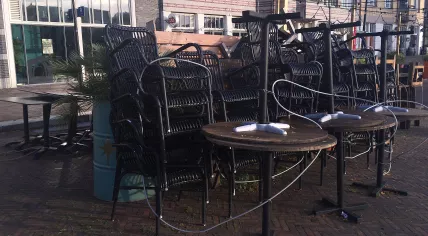 Tables and chairs stacked up on closed restaurant terraces in Amsterdam Oostpoort. 28 Oct. 2020