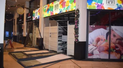The damaged storefront of a Polish supermarket in Beverwijk after the second explosion there in a week. 11 Dec. 2020 