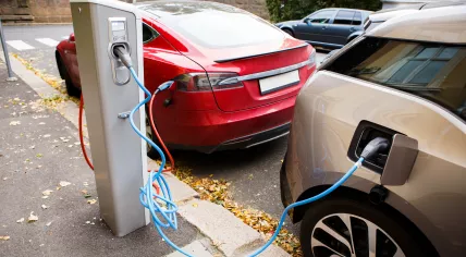 Electric cars charging on the street