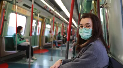 Masked people on a train in Wuhan, China