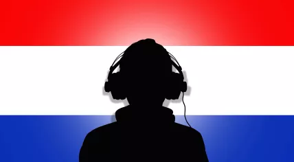Listening to music in front of the Dutch flag