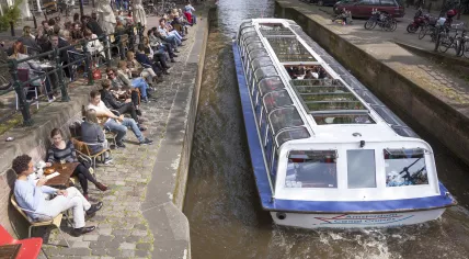 People enjoying a drink on an Amsterdam terrace. 14 May 2015