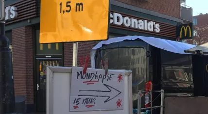 A sign at the Dappermarkt in Amsterdam advertising the sale of medical masks, 26 March 2020