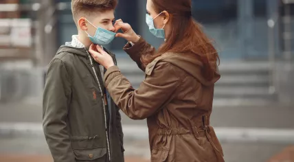Mother and child wearing medical masks