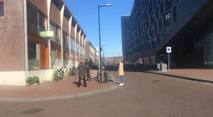 People waiting to view a home for sale in Amsterdam Oost, keeping their distance from each other due to coronavirus restrictions. 25 March 2020