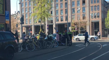Police speaking with people on the Javaplein in Amsterdam. April 26, 2020