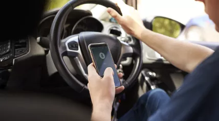 Mobile phone use behind the wheel