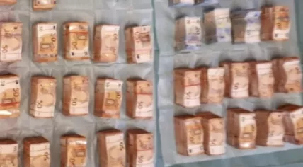 Bundles of cash: Part of a 2.4 million euro find inside a home in Amsterdam Oost