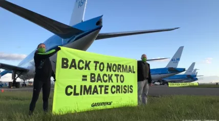 Greenpeace activists occupy a Schiphol runway to protest coronavirus aid to polluting aviation sector, 14 May 2020