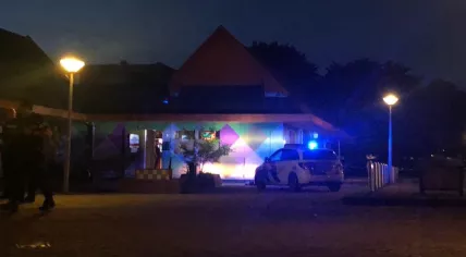 Police at the scene of a shooting outside a coffeeshop in Amsterdam Noord, 9 May 2020
