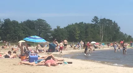 Almere Strand crowded, despite coronavirus social distancing measures, on a warm and sunny Ascension Day, 21 May 2020
