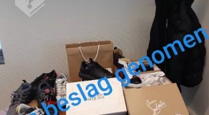 Designer clothes seized from a 21-year-old Groningen man suspected of a large number of phishing scams, 18 May 2020