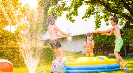 Kids playing with water on a hot day