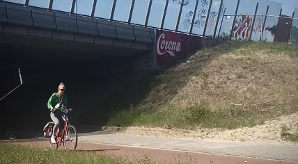 A street artist adapted the Coca-Cola logo to state “Corona” under the A10 ring road in Amsterdam IJburg. May 2020