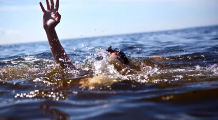 Stock image of a person struggling in the water 