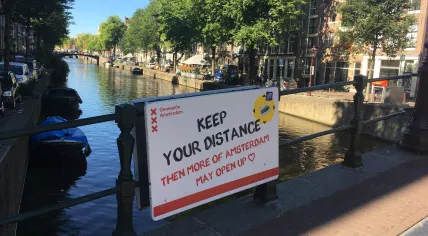 A sign on Korte Niezel promoting social distancing in Amsterdam. Aug. 5, 2020