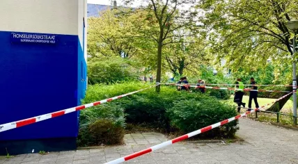 Crime scene tape at a fatal police-involved shooting on Honselersdijkstraat in Amsterdam, 13 August 2020