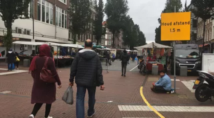 People warned to keep a safe social distance while entering the Dappermarkt in Amsterdam. 9 Sept. 2020