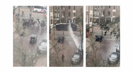 Police clear the streets intersecting Van Baerlestraat, south of Museumplein in Amsterdam