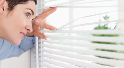 woman looking out of window
