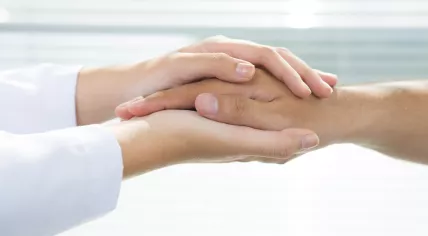 Two holding hands