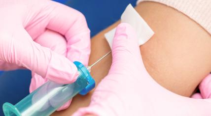 Nurse drawing a blood sample