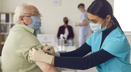 Elderly man getting vaccinated