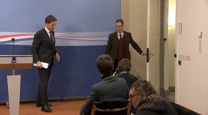 Mark Rutte exits a press conference after announcing the early end of his third Cabinet . 15 Jan. 2021