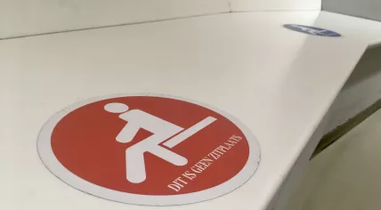 A bench marking off socially distanced seating places at the Hoog Catharijne mall in Utrecht. 2 Feb. 2021