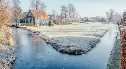 Frosted water in a canal in Zaanse Schans, Netherlands