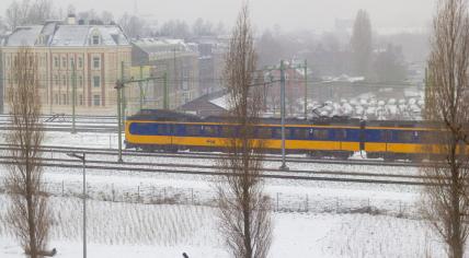 NS train in a snowy Amsterdam