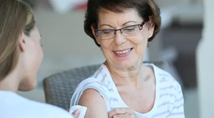 Woman receives flu vaccine