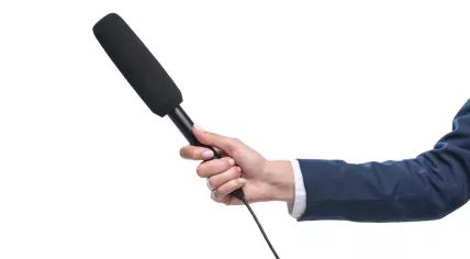 Journalist holding microphone