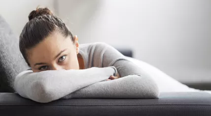 Stressed woman on couch
