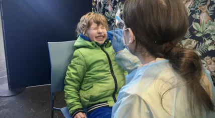 A young boy gets tested for the coronavirus infection in the Netherlands, March 2021