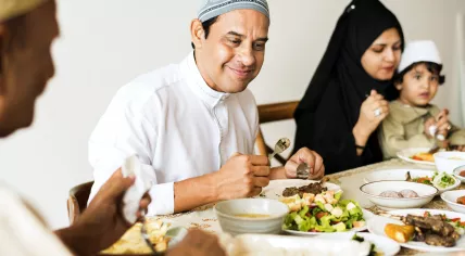 A Muslim family shares an iftar meal during Ramadan.