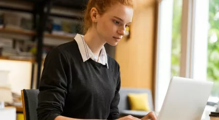 A student taking an online exam at home.