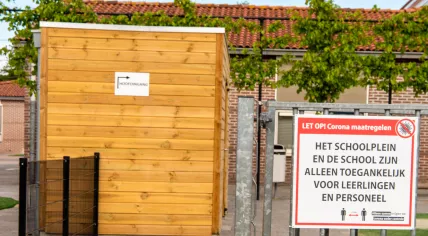 A sign at the entrance of school in Urk reminding of social distancing. 11 May 2020.