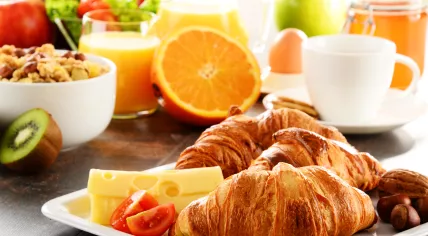 breakfast with croissant fruit cheese