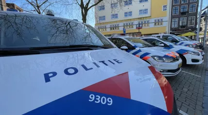 Police cars lined up across from the Nieuwmarkt in Amsterdam. 19 March 2021