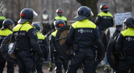 Riot police at an anti-lockdown protest at the Malieveld in The Hague, 14 March 2021