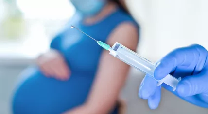 Pregnant woman receive a vaccine.