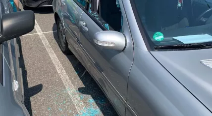 A car window was smashed open to free three children trapped in a hot car. 27 June 2021