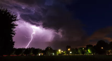 Beautiful big flash of lightning in the night sky over Baambrugge in the Netherlands