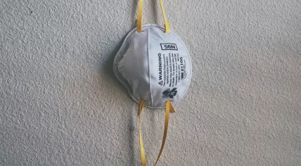 A N95 face mask hanging on a wall. June 13, 2021