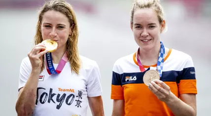 Annemiek van Vleuten (L) with her gold medal and Anna van der Breggen with her bronze medal after the individual cycling time trial on the Fuji International Speedway during the Olympic Games in Tokyo, 28 July 2021