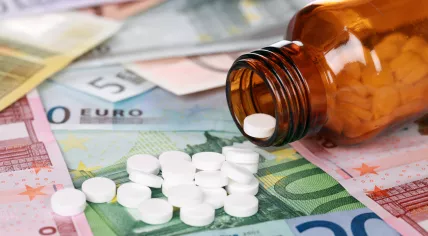 Prescription pills on a pile of euro banknotes