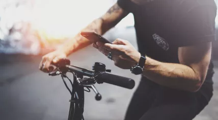 Man regulates speed on e-bike with app