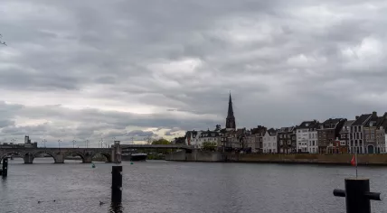 Clouds above the Maas river in Maastricht, with the Wilhelminabrug bridge in the distance. May 10, 2021